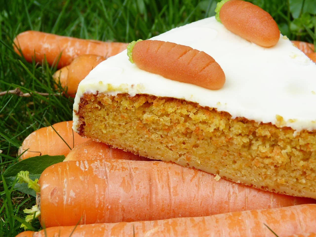 A slice of carrot cake with cream cheese icing